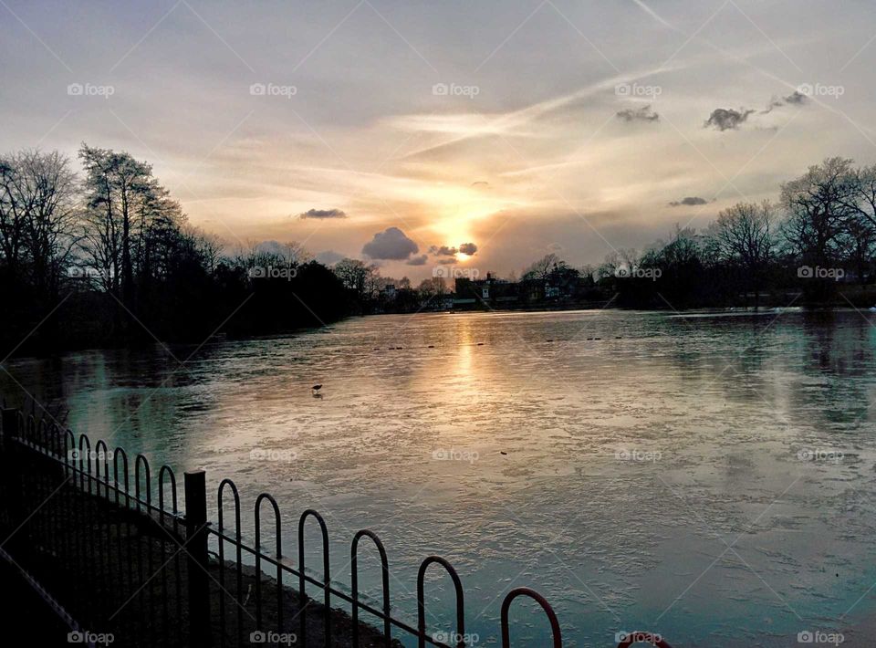 Frozen lake at sunset 🌇