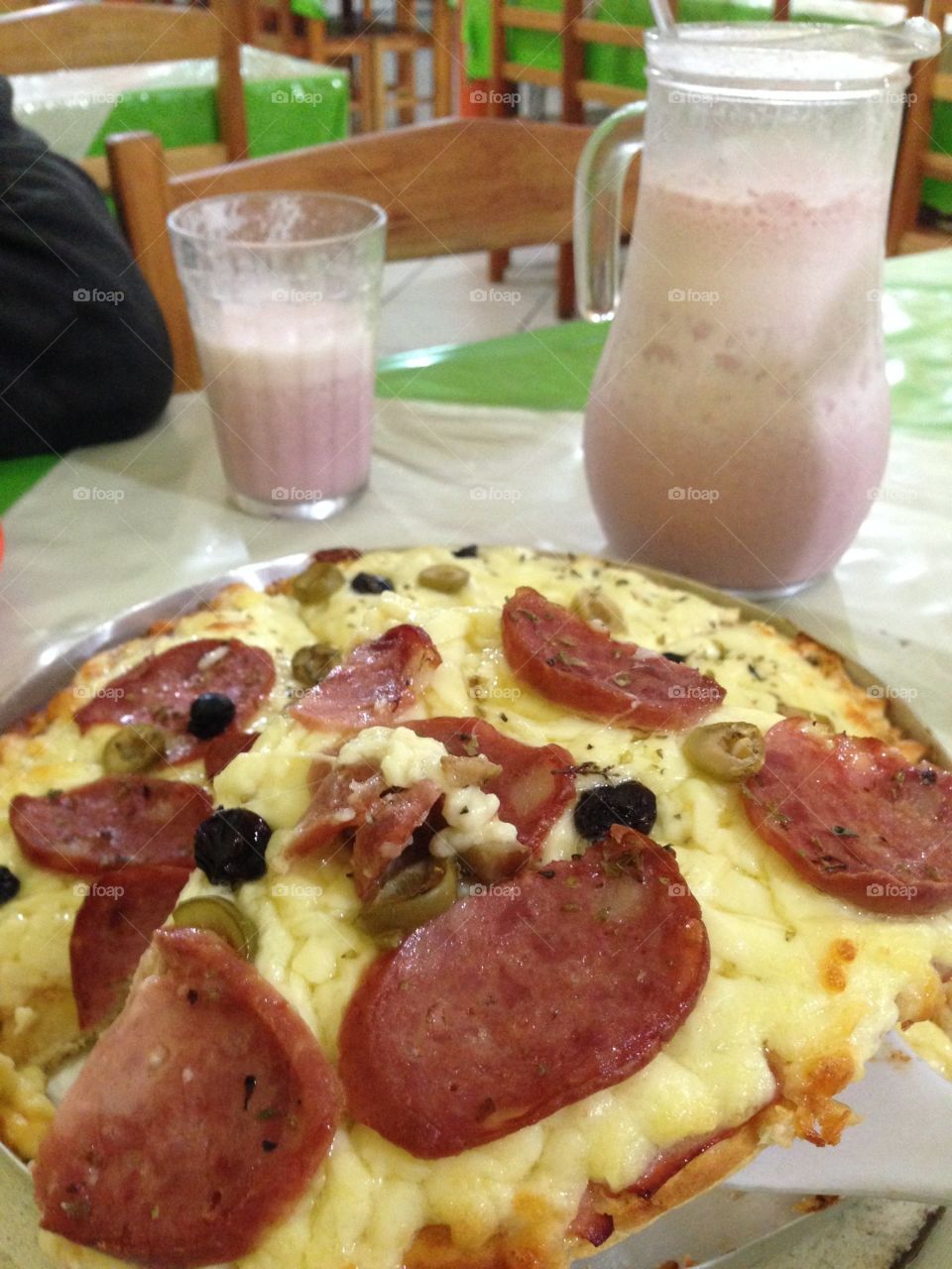 Nothing is more delicious than pizza with strawberry shake