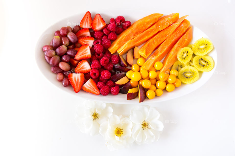 Fresh summer fruit platter with yellow red and purple fruit. Healthy food to improve health and weight loss. I love fresh fruit.