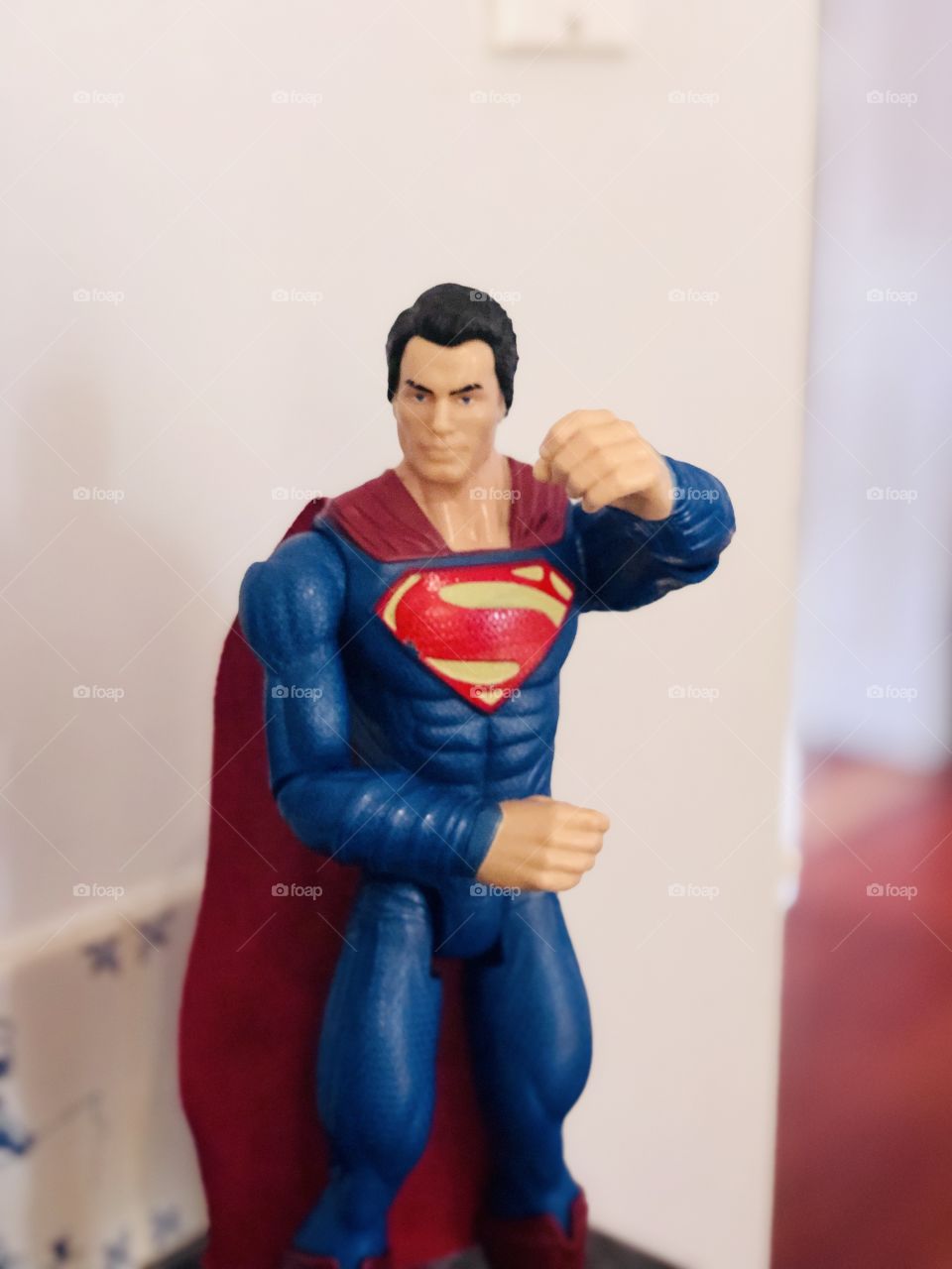 Superman toy action figure ready to deliver a punch of steel!