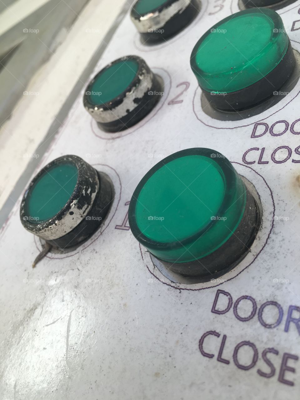 Close-up of green push button