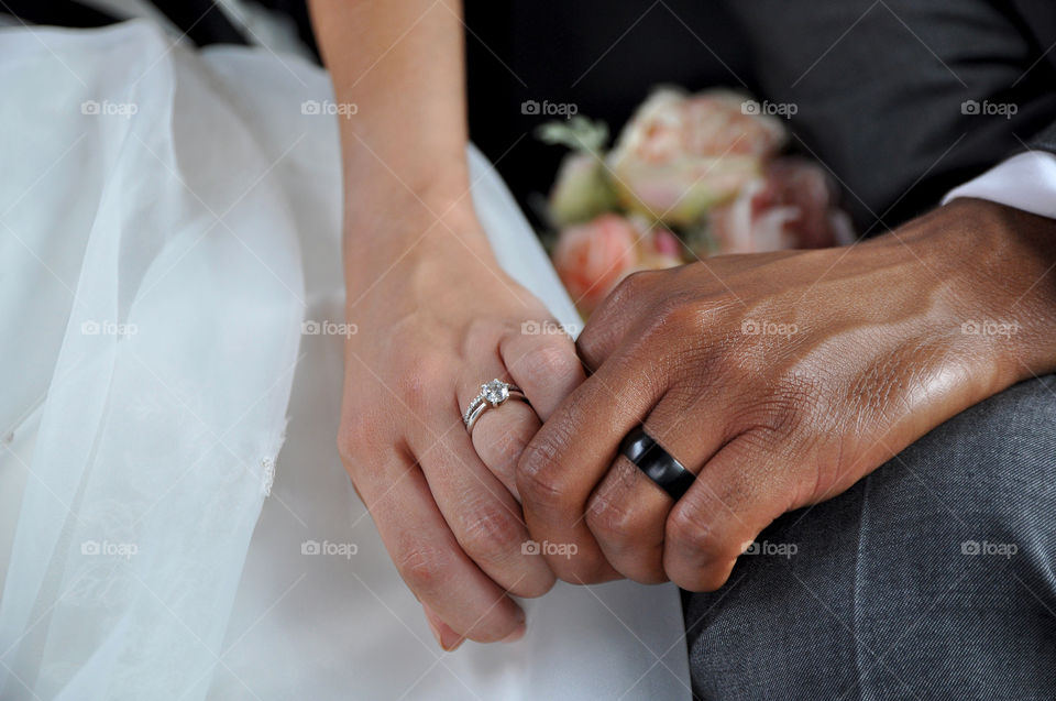 Just Married Interracial Couple Holding Hands Wearing Wedding Rings