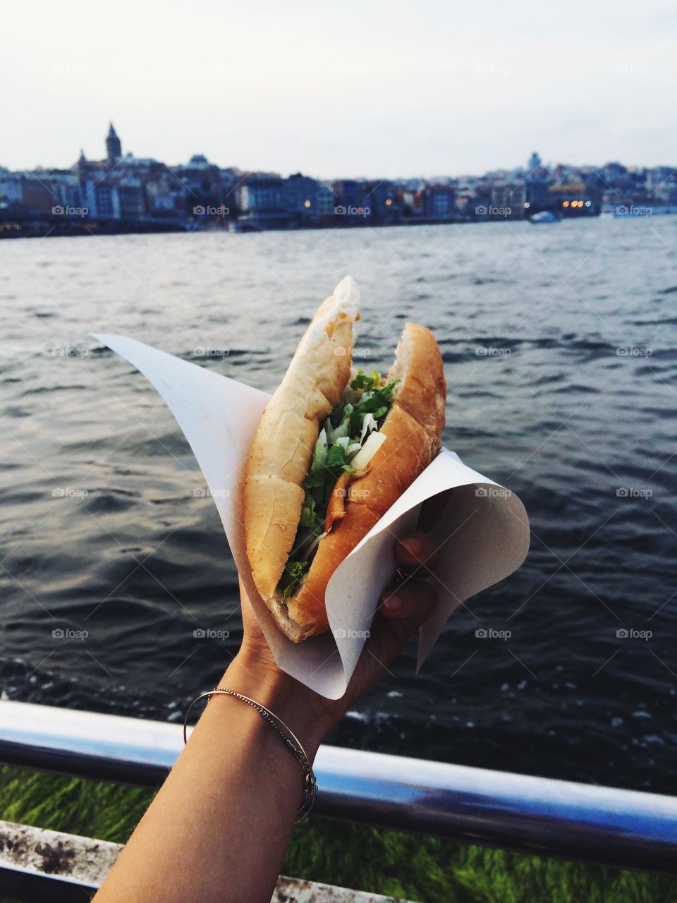 Close-up of person's hand holding sandwich