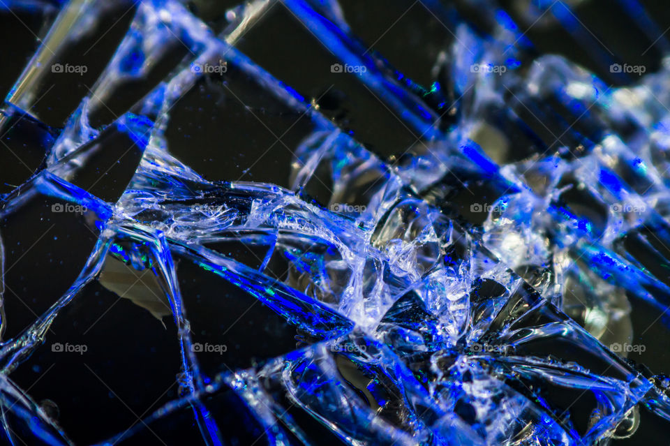 Spider web of broken glass of mobile phone close up