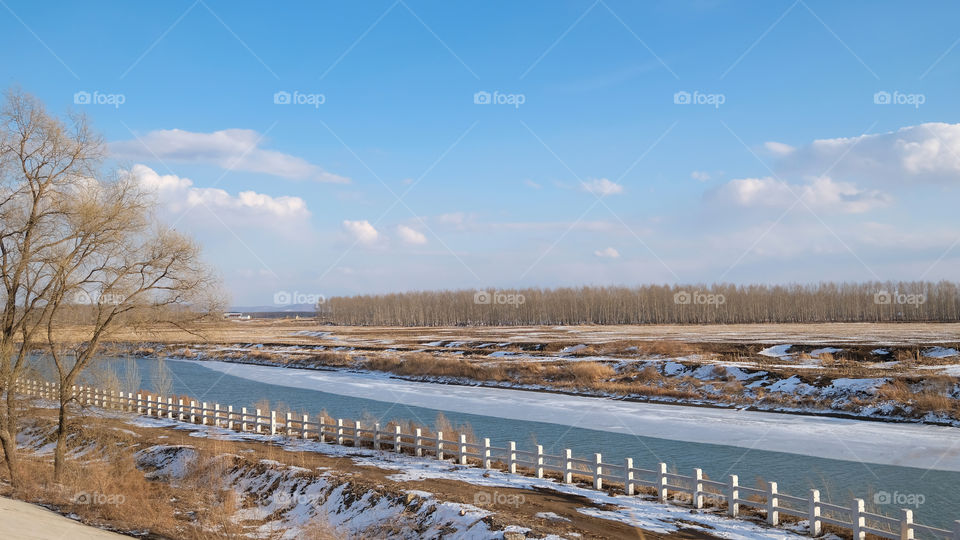 the ice on the river is melting