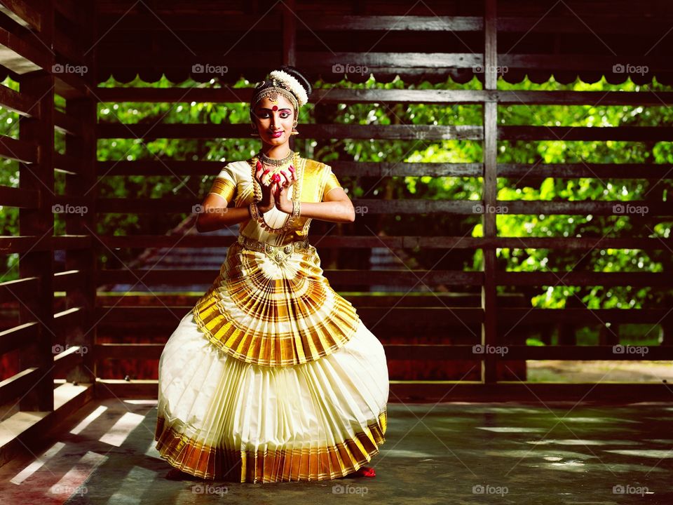 Mohiniyattam, also spelled Mohiniattam (Malayalam: മോഹിനിയാട്ടം), is one of two classical dances of India that developed and remain popular in the state of Kerala.[1][2] The other classical dance form from Kerala is Kathakali.[3][4] Mohiniyattam dance gets its name from the word Mohini – a mythical enchantress avatar of the Hindu god Vishnu, who helps the good prevail over evil by deploying her feminine powers.[1][5]

Mohiniyattam's roots, like all classical Indian dances, are in the Natya Shastra – the ancient Hindu Sanskrit text on performance arts.[6][7] However, it follows the Lasya style described in Natya Shastra, that is a dance which is delicate, eros-filled and feminine.[2][8] It is traditionally a solo dance performed by women after extensive training. The repertoire of Mohiniyattam includes music in the Carnatic style, singing and acting a play through the dance, where the recitation may be either by a separate vocalist or the dancer herself. The song is typically in Malayalam-Sanskrit hybrid called Manipravala.[2]

The earliest mention of the word is found in the 16th-century legal text Vyavaharamala, but the likely roots of the dance are older.[9] The dance was systematized in the 18th century, was ridiculed as a Devadasi prostitution system during the colonial British Raj, banned by a series of laws from 1931 through 1938, a ban that was protested and partially repealed in 1940.[10] The socio-political conflict ultimately led to renewed interest, revival and reconstruction of Mohiniyattam by the people of Kerala, particularly the poet Vallathol Narayana Menon.[2]