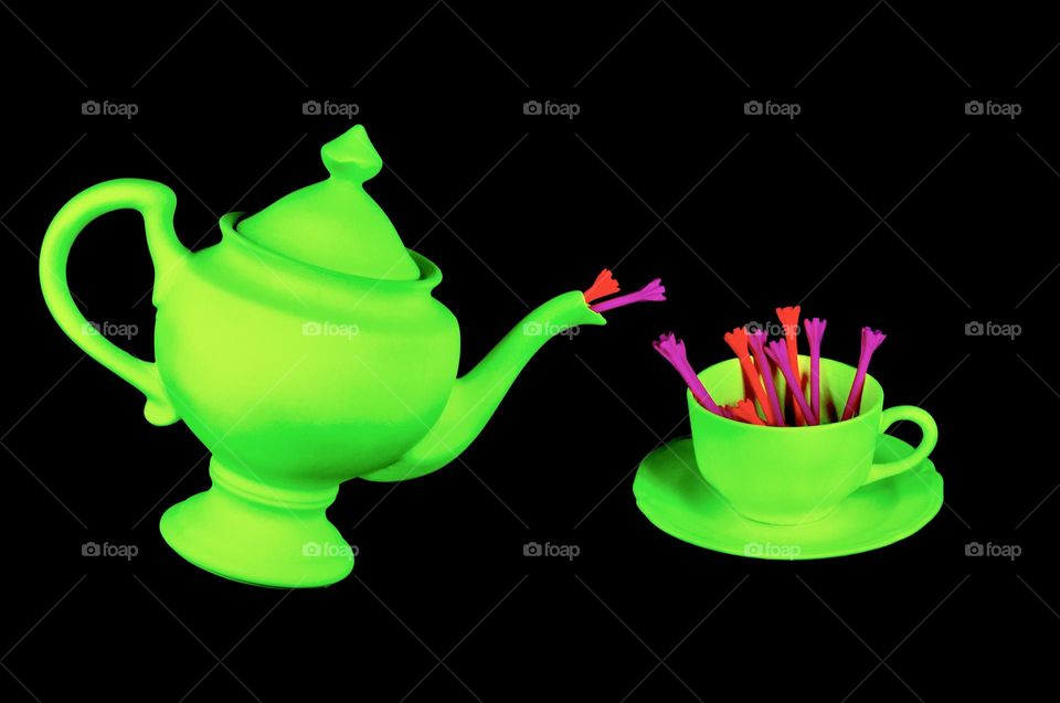 Fluorescent teapot cup and saucer with teas