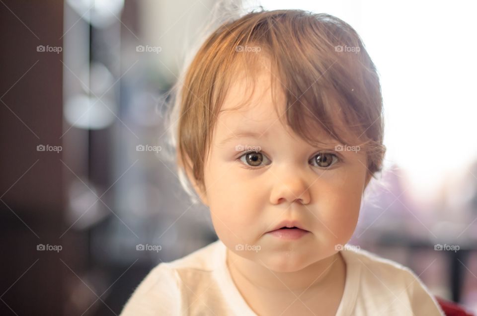 Extreme close-up of baby looking at camera