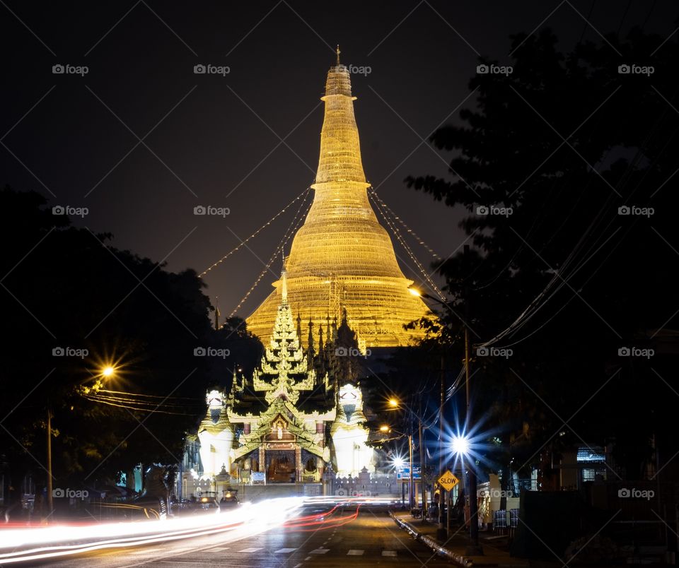 Vehicle light leading line to the beautiful Shwedagon pagoda to show golden light in the night