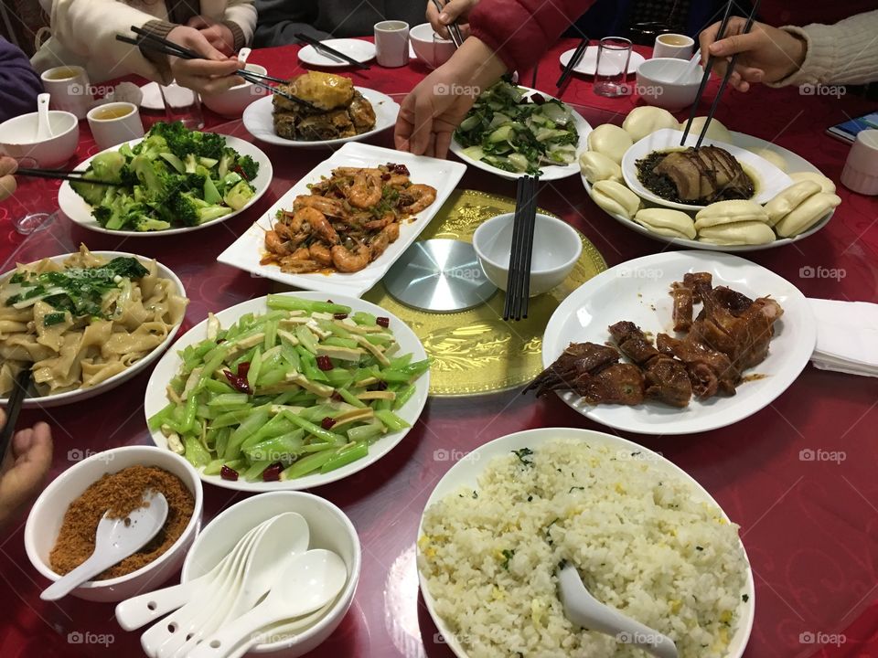Chinese food usually serves on a circular table. Everyone on the table can talk a face-to-face with each other.