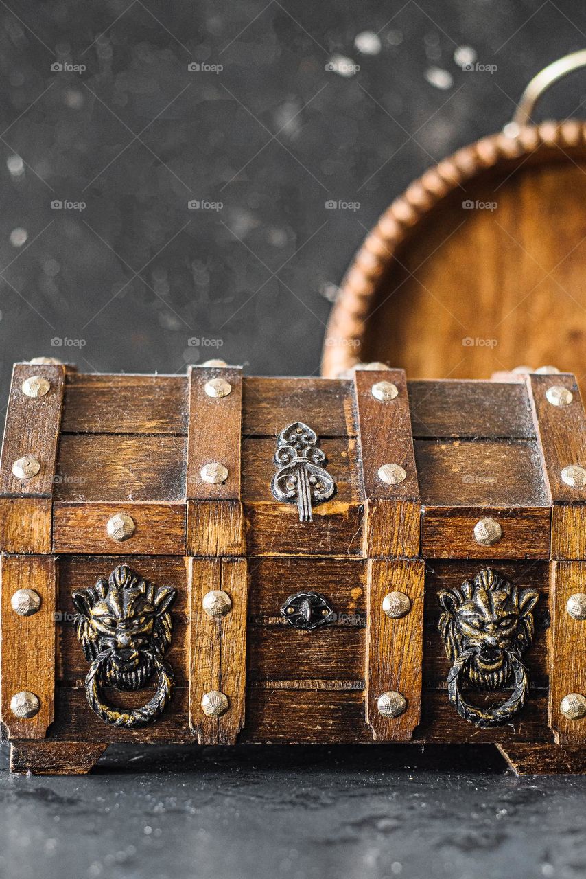 Wooden box with metal decor.