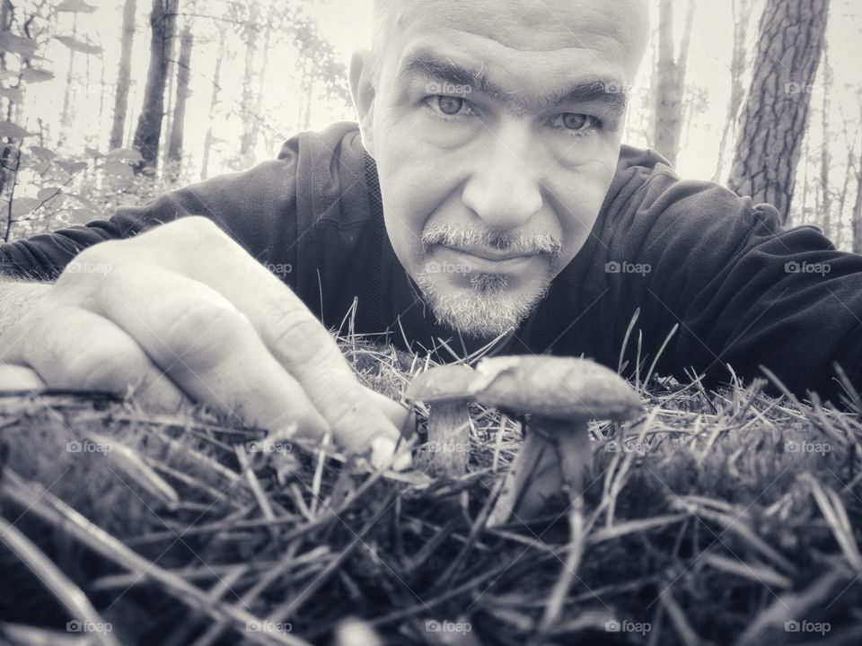 Men's portrait in the autumn forest