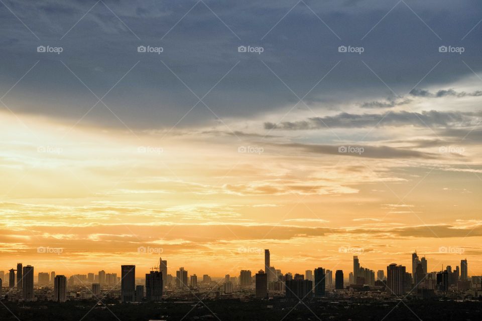 Twilight and fog cover skyscraper scape after rain in Bangkok Thailand