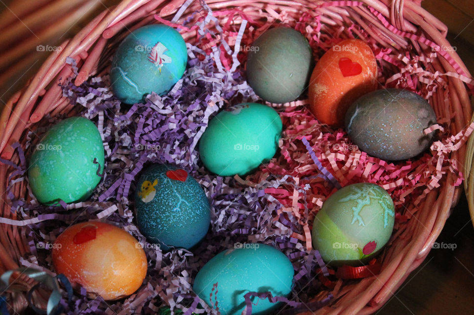 A pink wicker basketful of beautifully dyed and decorated eggs ‘eggs’pertly crafted by my daughters and niece while I was cooking an Easter feast! Great fun had by all!