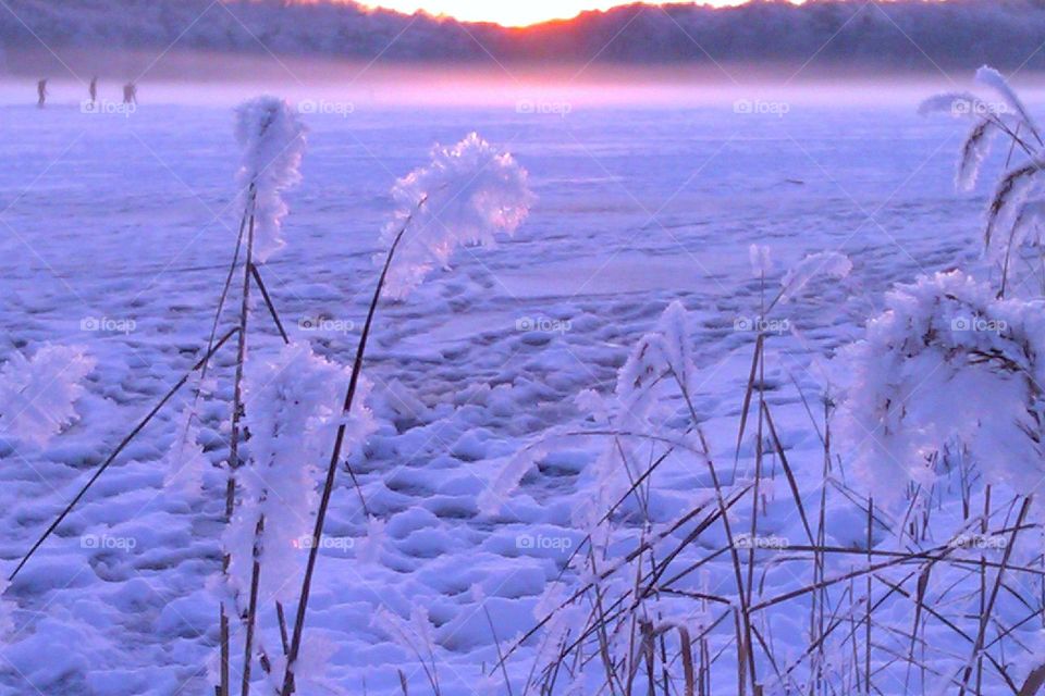 Sunset at the lake in winter time