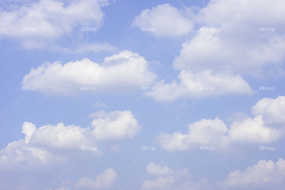 The beauty of the sky with clouds and the sun in summer.