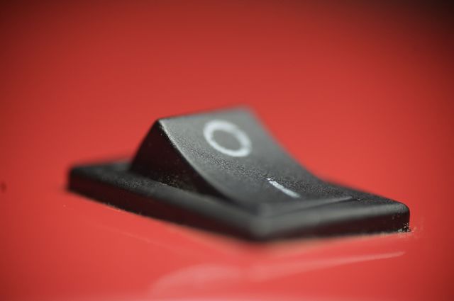 Macro photo of on and off button with red background 