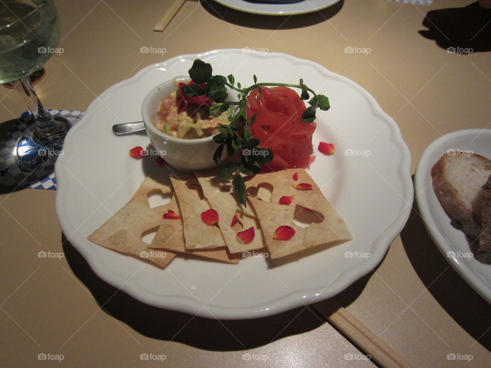 Alice in Wonderland Theme Restaurant in Tokyo, Japan. Appetizer of Playing Card Shaped Flat Breads, Rose Petals and Herb Spread. Beautiful Plating.