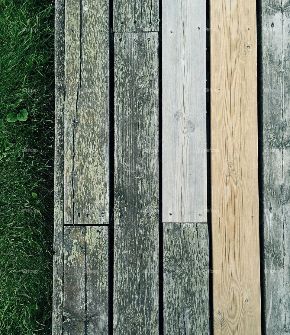 Diversity. Wooden planks on the grass