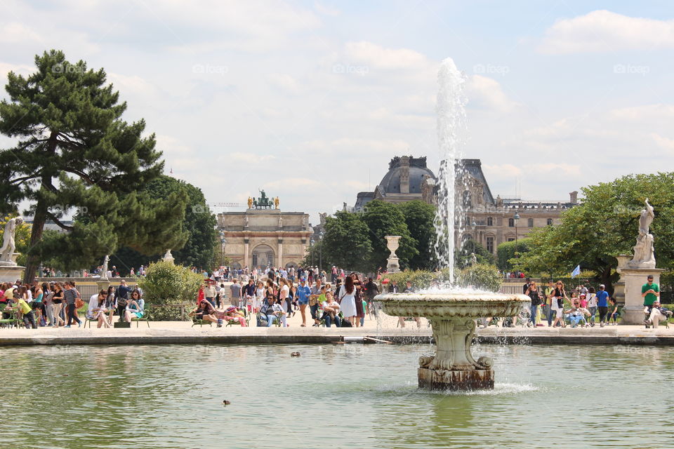 People are hanging out in a touristic area of Paris