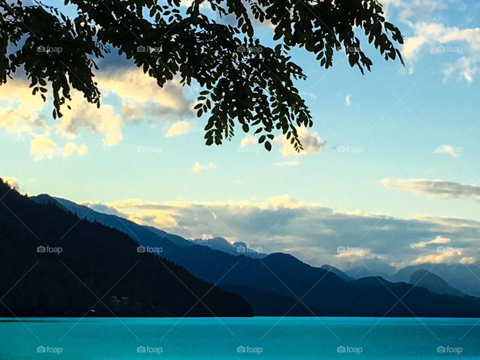 Beautiful Harrison lake captured at dusk the view in front of Harrison Hotsprings resort a few hours away from Vancouver, beautiful backdrop if west coast mountains 