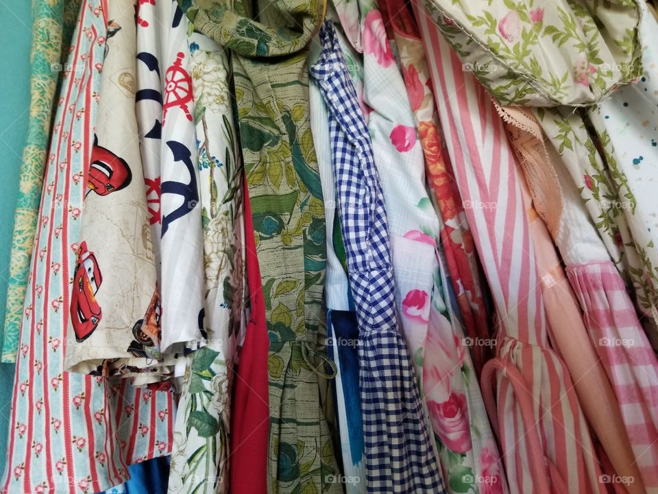 Sample of dresses and skirts in a closet