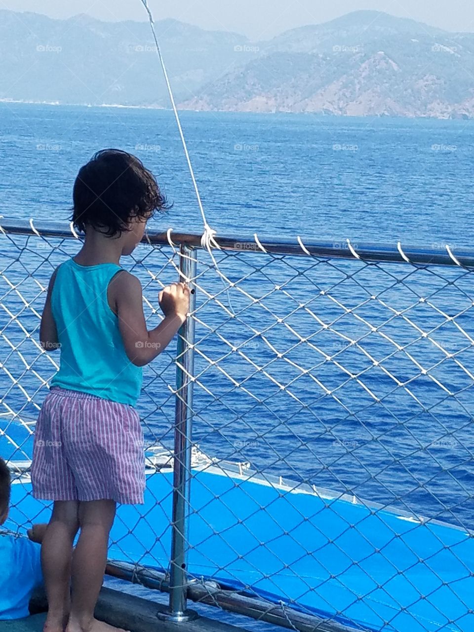 kids enjoying the view of the sea and mountains in fethiye turkey