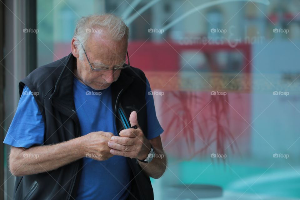 Smartphone. Elderly man with smartphone.