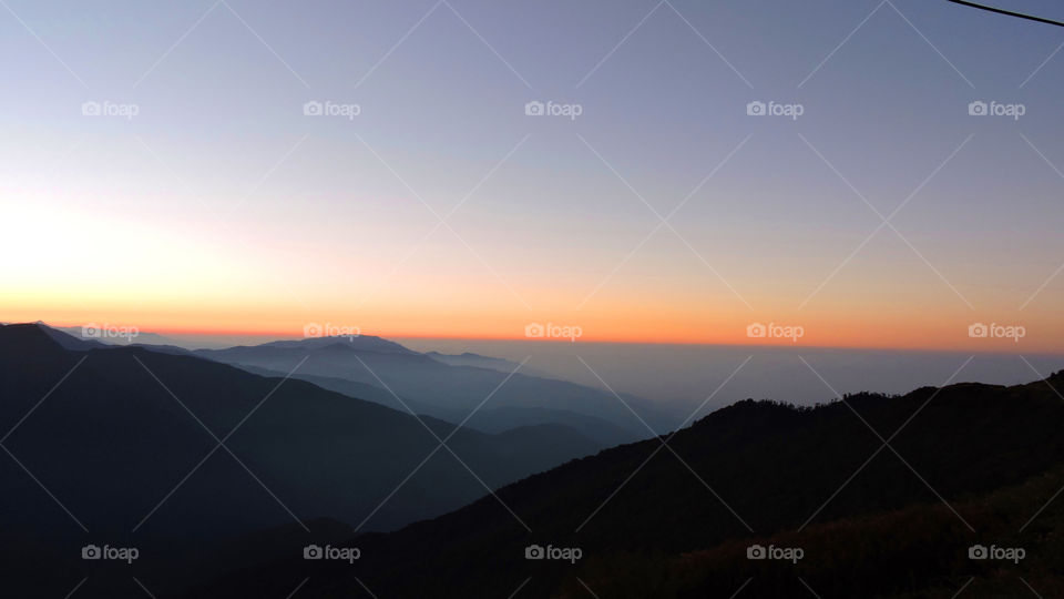 first rays of sun in the mountains