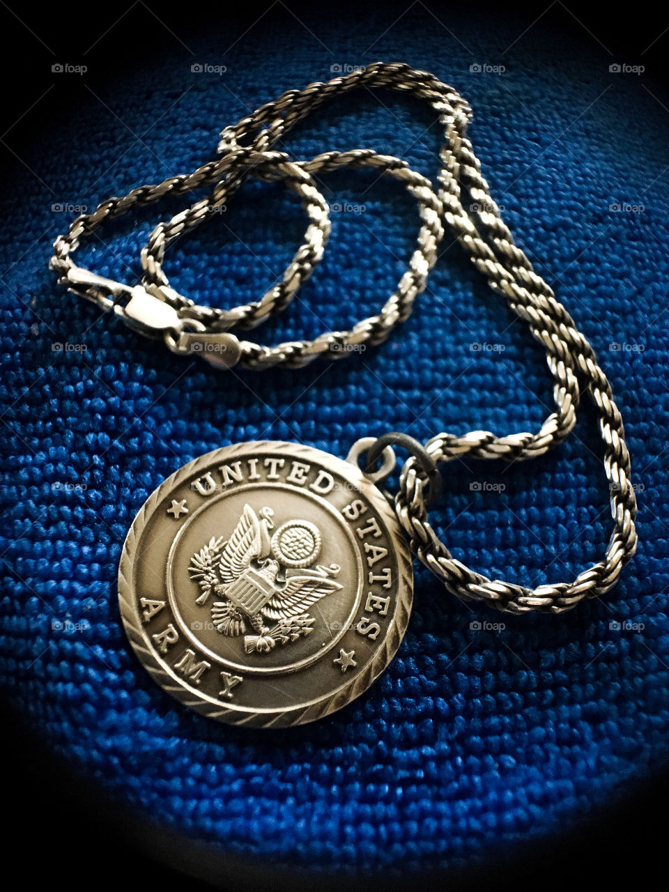 United States Army medallion with silver chain.