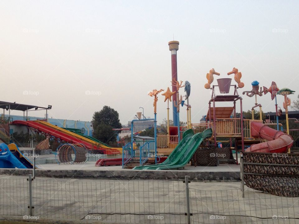 Lonely kids playground in autumn