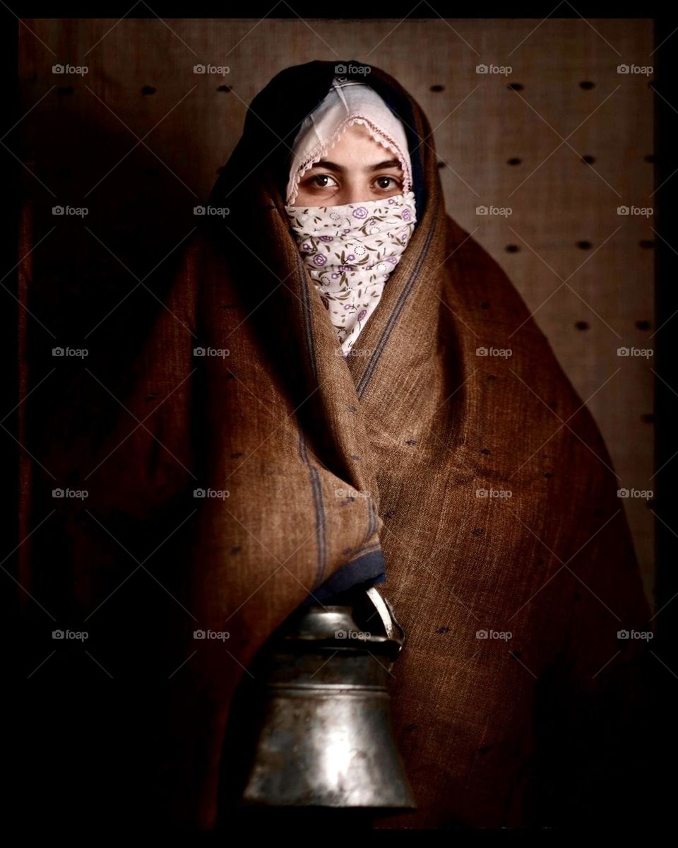 Anatolian woman holding a copper bucket