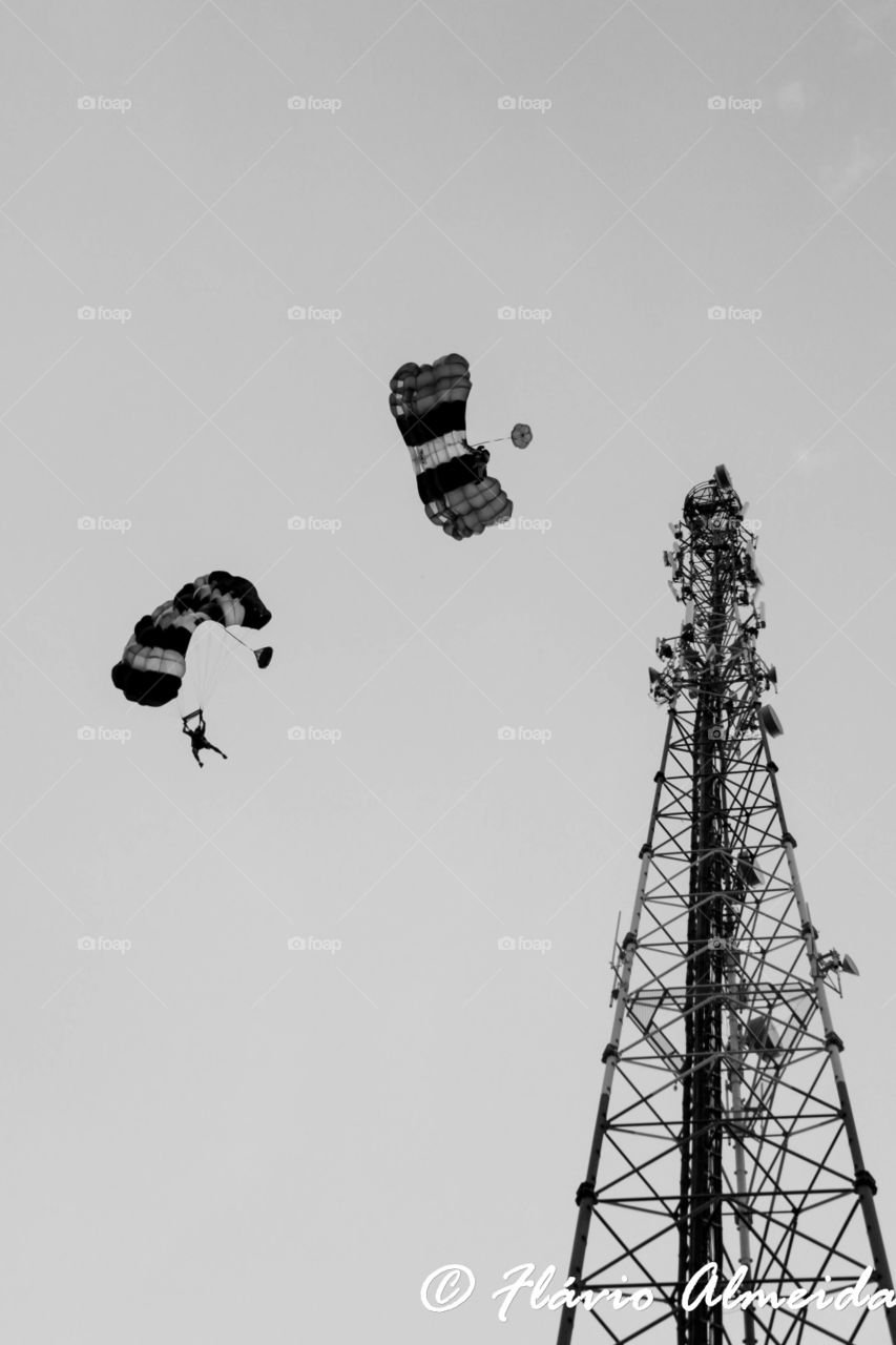 base from antena. 2 base jump parachutes opening at the same time after a jump from an antena