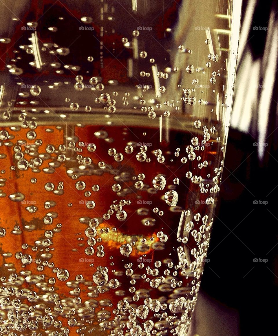 A glass full playfull bubbles