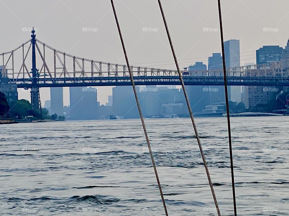 This is a view of one of three bridges encompassing the “Hell Gate” area of the “East River” north of “Manhattan” which can be seen in the background. Undercurrents can form here that cause a boat to move around in circles. 2023. Hypnotic Productions