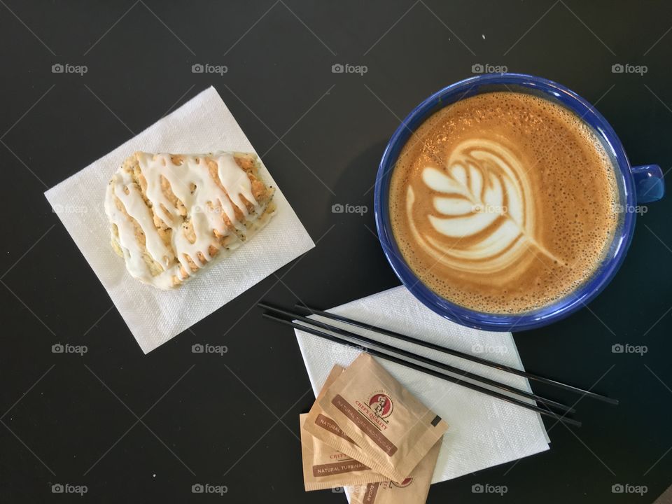 Coffee. Pretty latte and scone top down