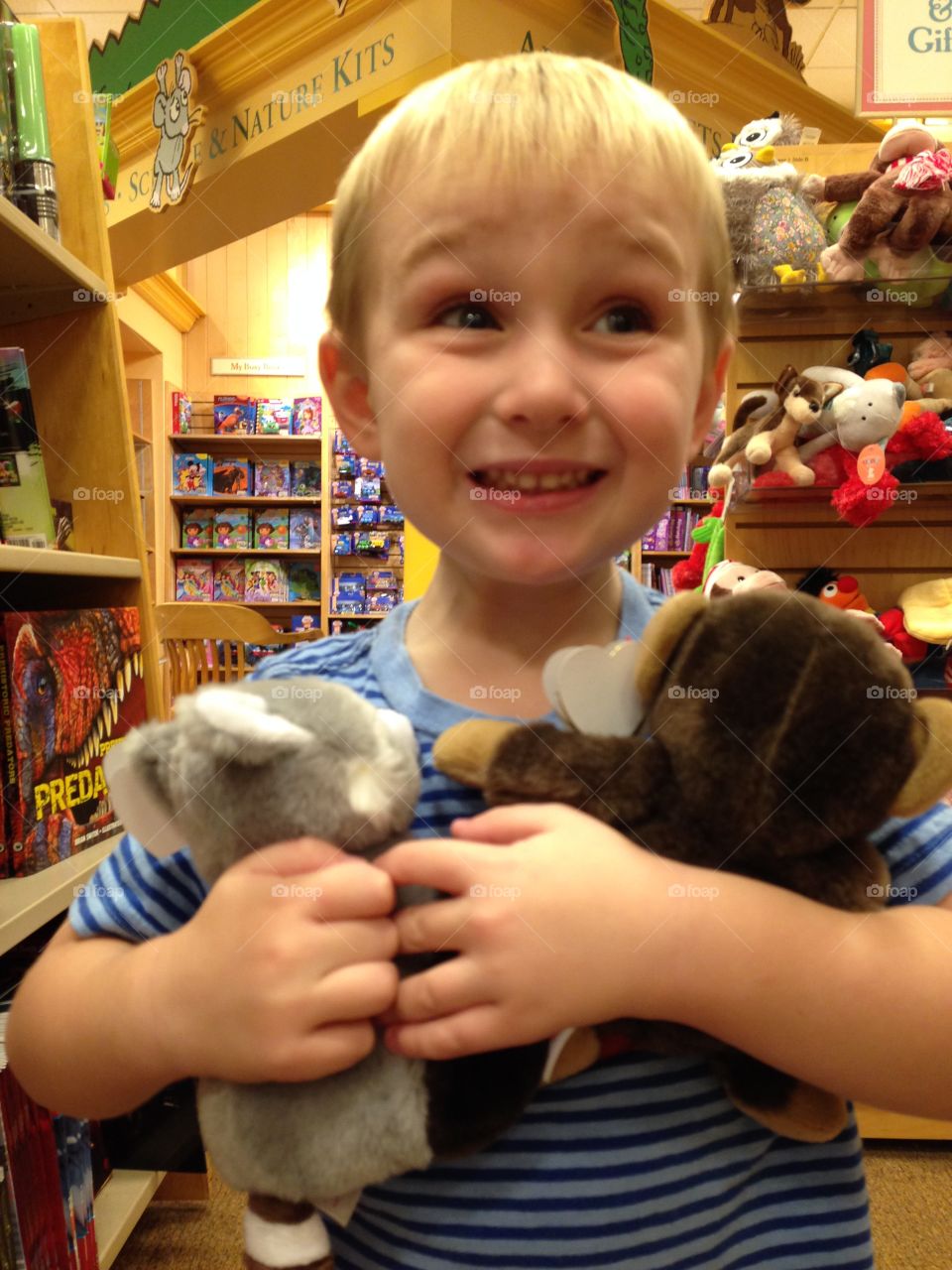 Boy holding toy in toy shop