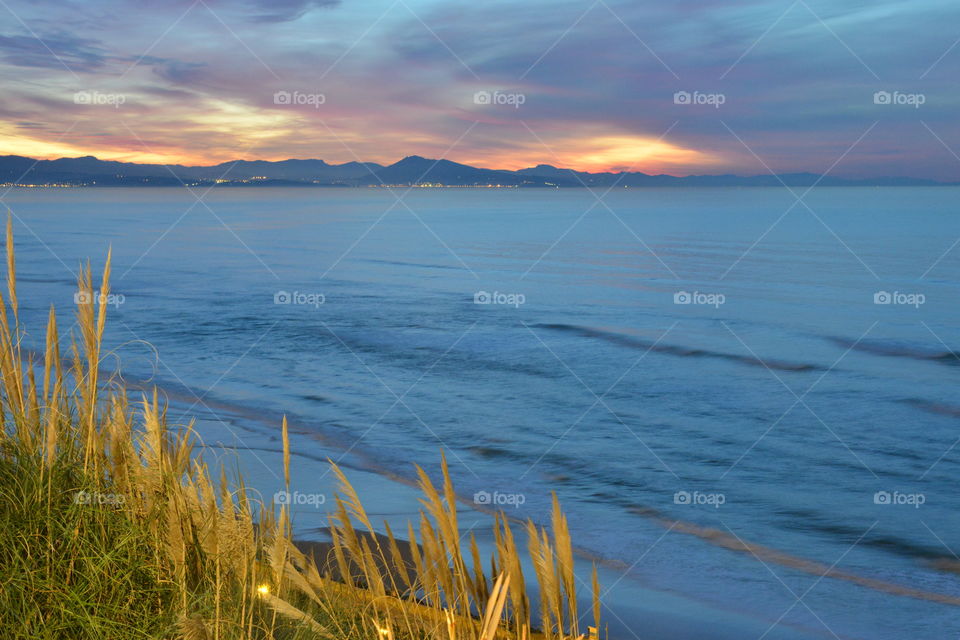 Scenic view of idyllic sea during sunset