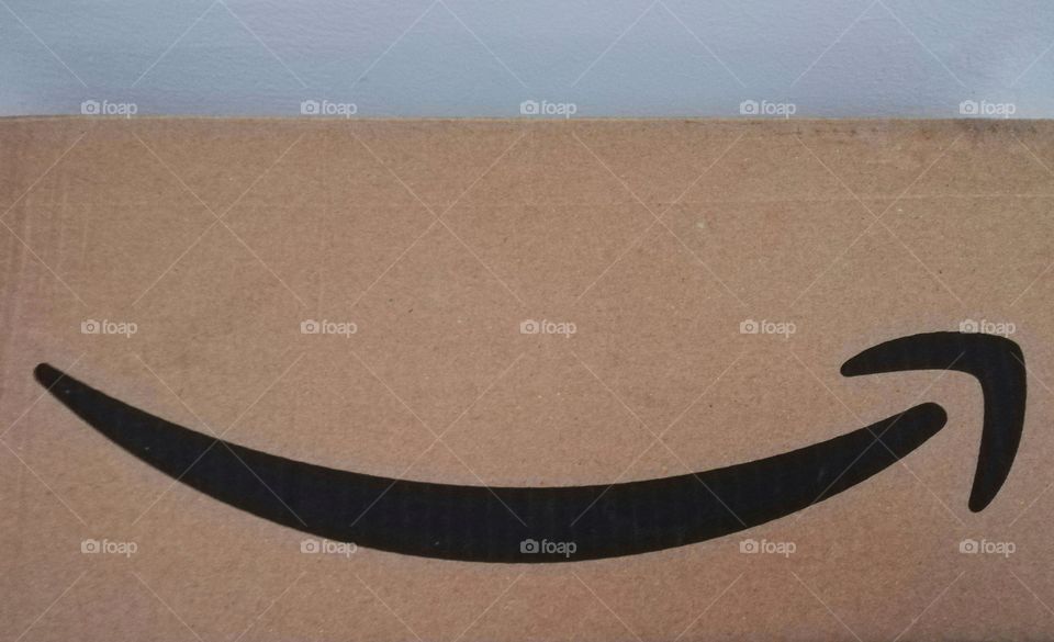 Amazon logo on a cardboard box