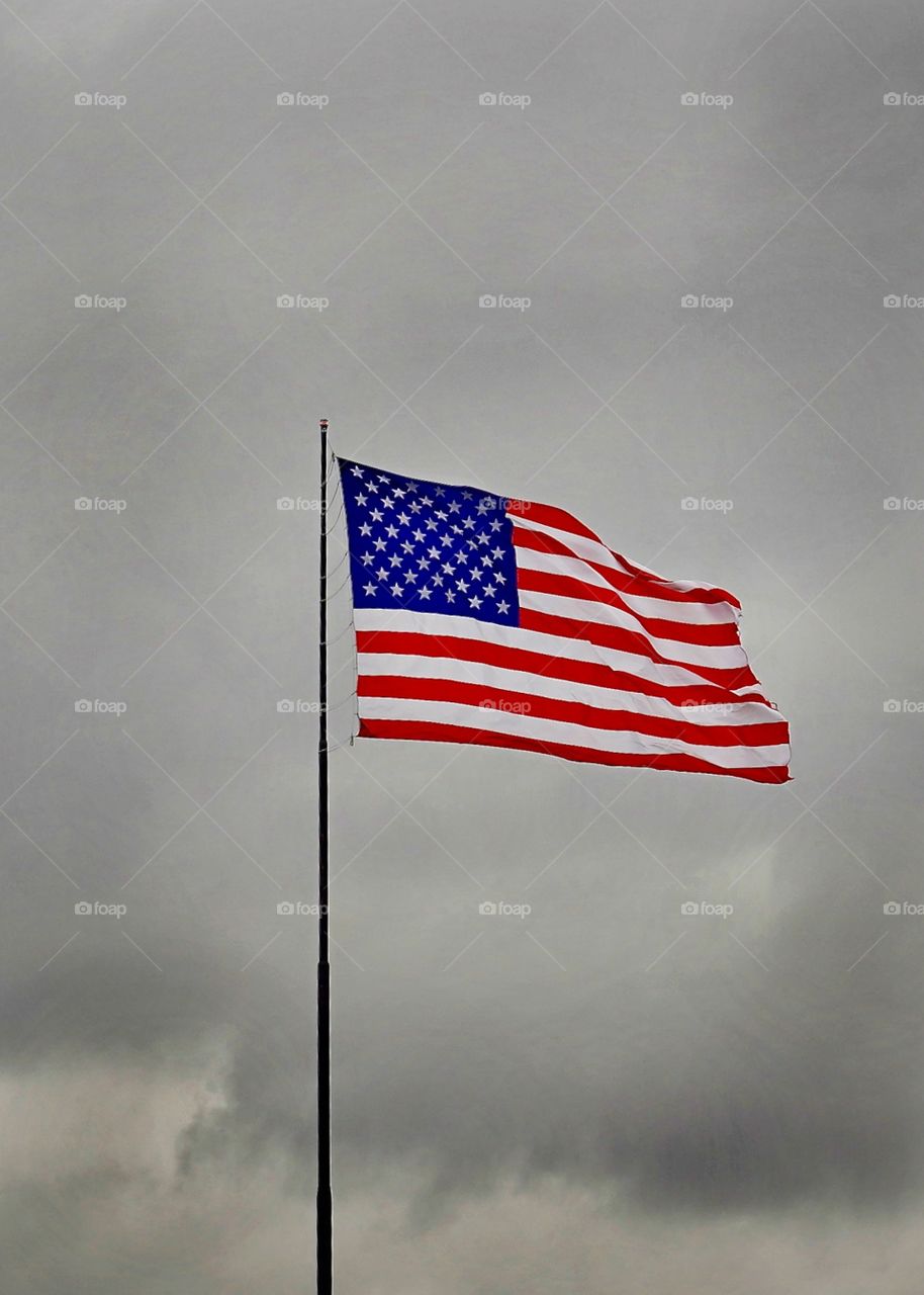 Stormy skies will never dim the spotlight on the United States flag.