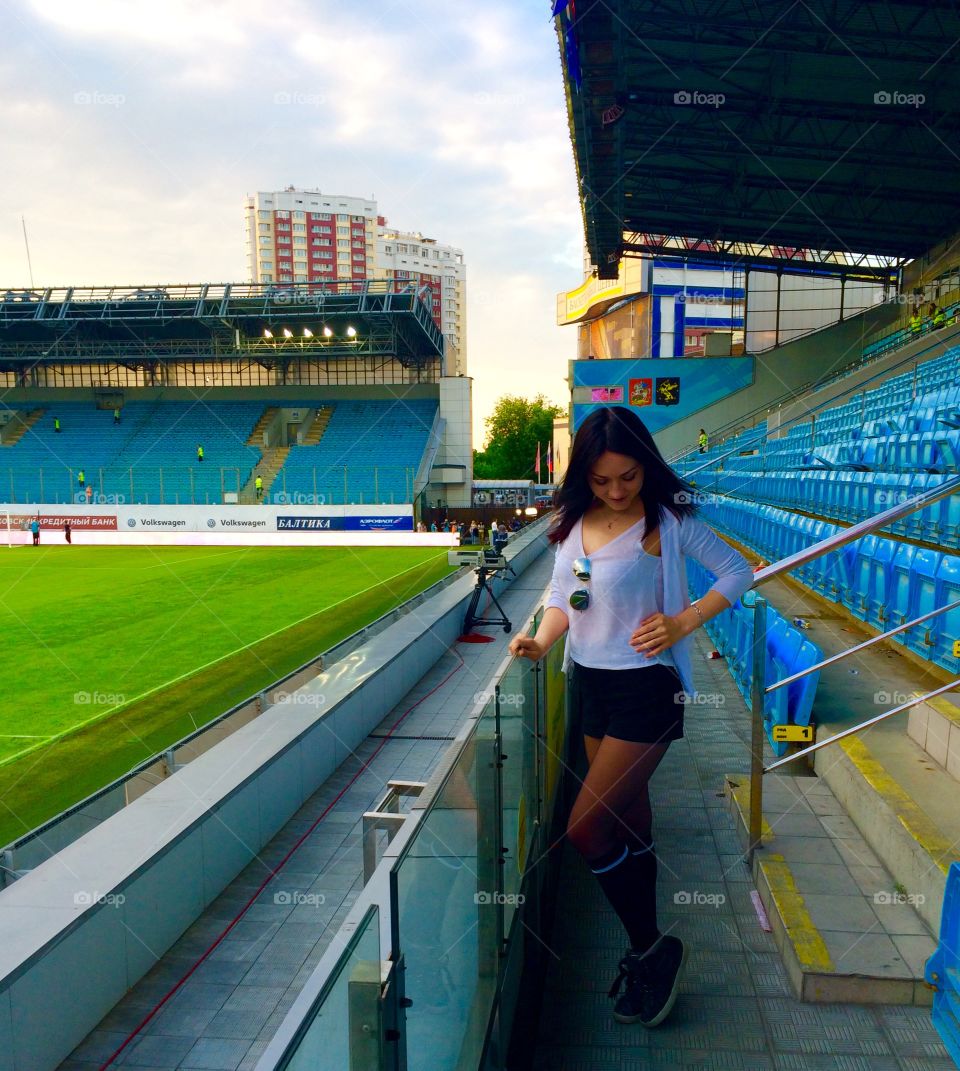 Young woman posing in stadium