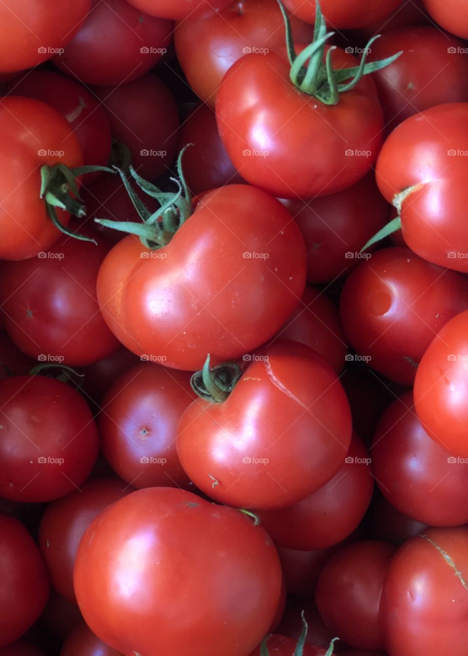 Full frame shot of fresh red tomatoes for sale at a market place. 