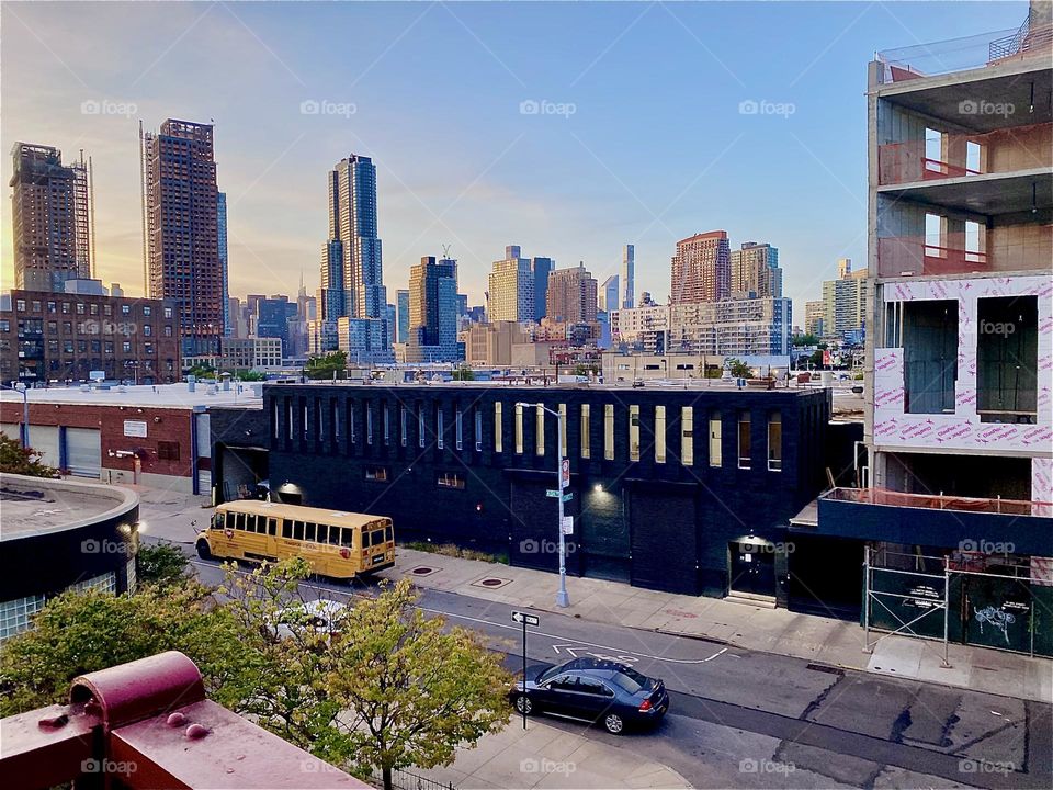 This is the view from about halfway up the red metal stairs of the “Pulaski Bridge” at “Newtown Creek” on the “Greenpoint”, Brooklyn side of the bridge on a nice sunny Indian summer evening in early October 2023. Hypnotic Productions