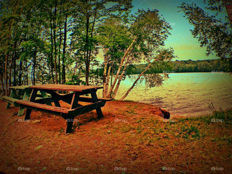 Picnic table by lake.