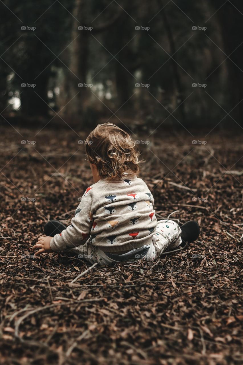 Child Playing with Leaves