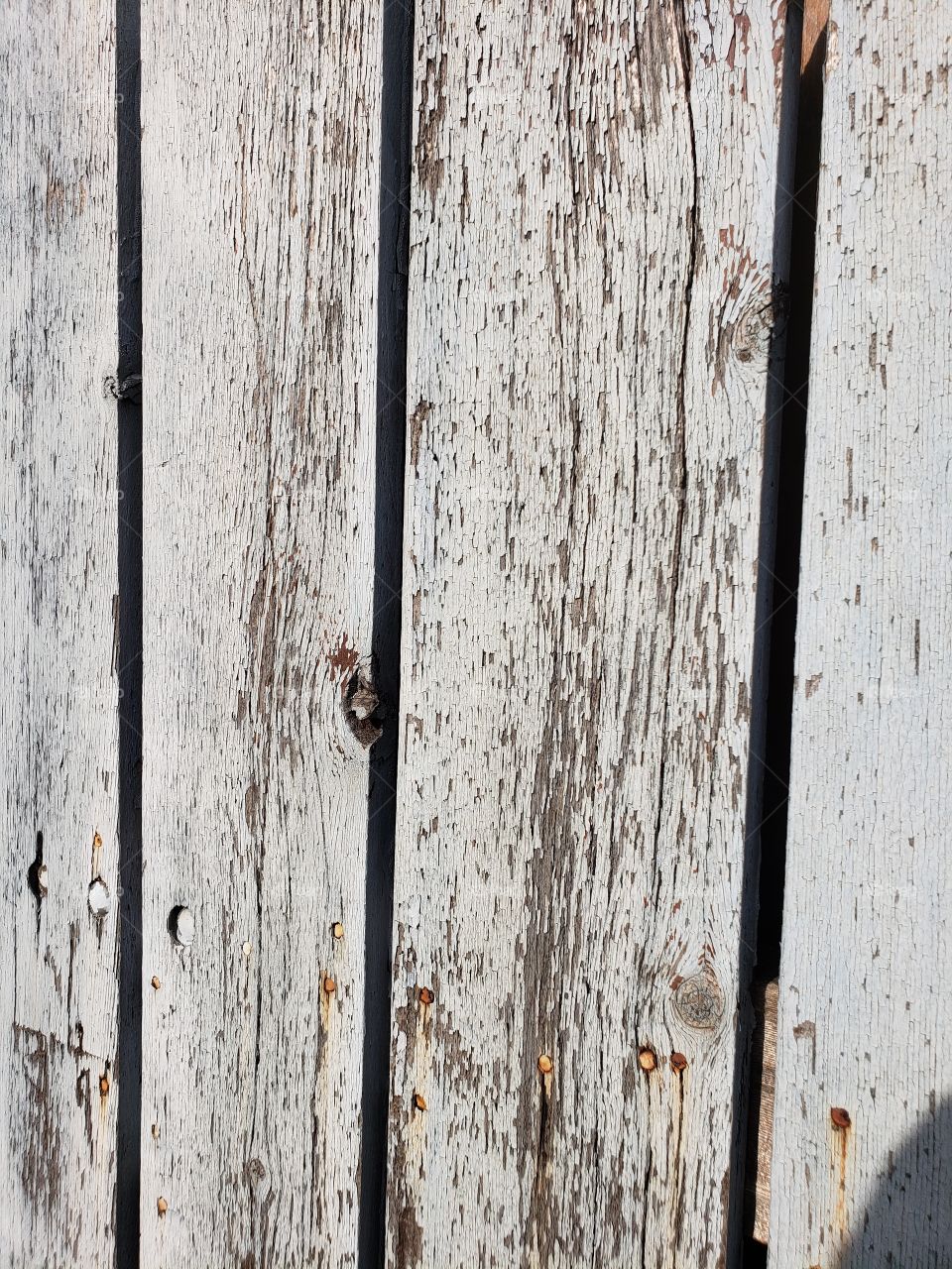 old weathered painted wood fence boards