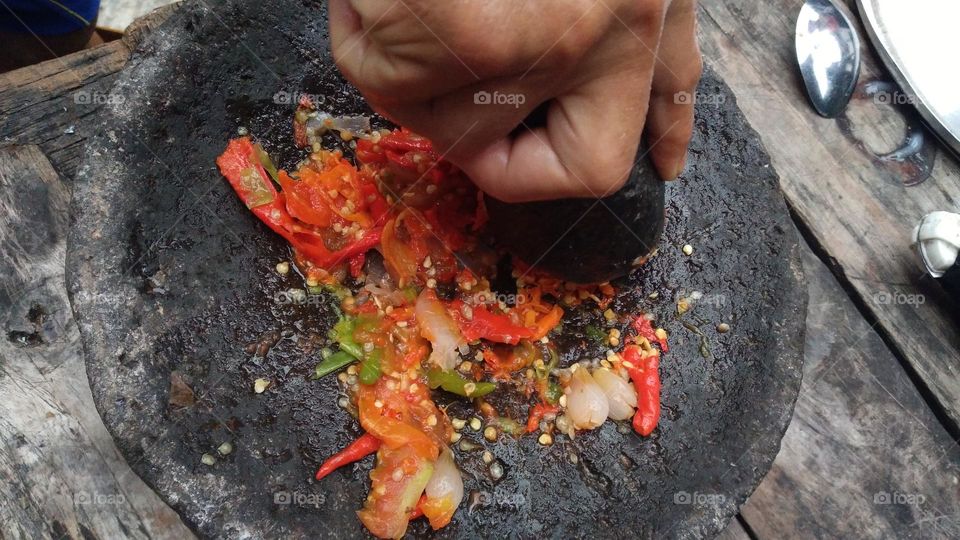 chili sauce is made from chili which is crushed so that the essence of chili comes out and other ingredients are added, such as salt and shrimp paste.