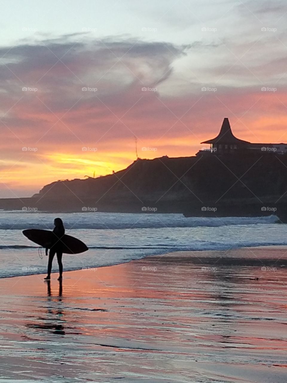 Surfer at sunset.
