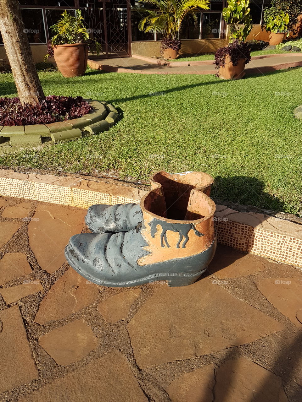 It's not just a shoe but a one of a kind flower pot. It shows creativity and unique use of art.