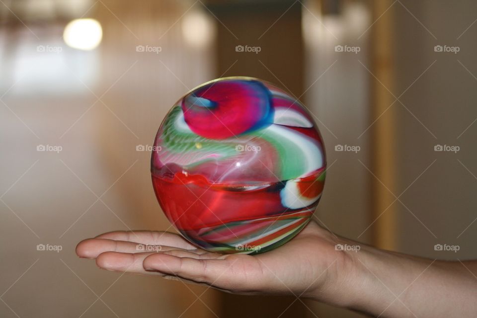 A bouncy ball held in a hand